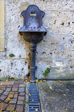 Public water supply, tap with drinking water connection and drainage basin at the town museum