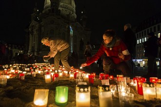 On the 69th anniversary of the Allied bombing of Dresden, Dresdeners commemorate with candles at