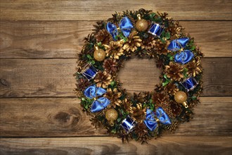 Christmas wreath on wooden background