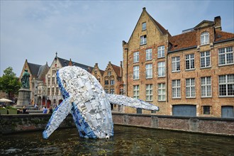 BRUGES, BELGIUM, MAY 29, 2018: Skyscraper or The Bruges Whale, whale rising up from the Canal