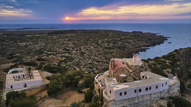 Drone shot, dusk, sunset, cloudy sky, square yard, sea, Chrissoskalitissa, rock monastery, Orthodox