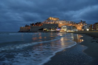 Old town with the Romanesque castle from the 14th century, blue hour, Peñíscola, province