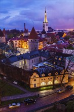 Aerial view of Tallinn Medieval Old Town illuminated in evening, Estonia, Europe