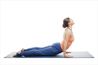 Woman doing Surya Namaskar Sun Salutation Ashtanga Vinyasa Yoga asana Urdhva mukha (Urhdvamukha)