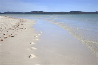 White sandy shoreline of Whitehaven Beach on Whitsunday Island in the Coral Sea, Queensland,