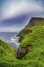 Huge cliffs in Gasadalur, Vagar, Faroe islands, Denmark, Europe