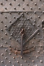 Old door knocker on the front door of the former Palazzo Pinelli Parodi in the historic centre,