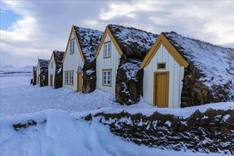 Peat huts in the snow, Glaumbaer Museum Village, Northern Iceland Vestra, Iceland, Europe