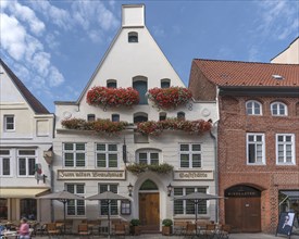 Flower decoration on a historic gabled house from 1658, Lüneburg, Lower Saxony, Germany, Europe