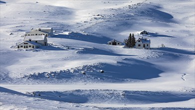 Farmhouse in snow-covered hilly landscape, near Akureyri, North Iceland Eyestra, Iceland, Europe