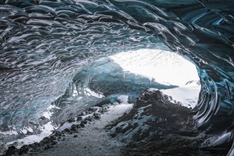 Aquamarine-coloured ice combs at the entrance to Pröng Ice Cave, Sudurland, Iceland, Europe