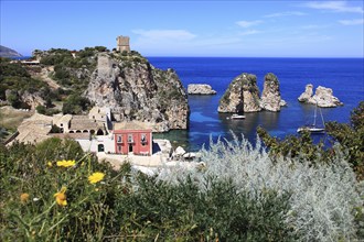 Province of Trapani, the Tonnara of Scopello and watchtower on the Tyrrhenian Sea near the town of