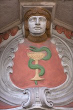 Art Nouveau figure and sign above the entrance of a pharmacy, Erlangen, Middle Franconia, Bavaria,