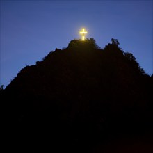 Illuminated cross on the Pinnerkreuz lookout peak in the evening, Cochem, Rhineland-Palatinate,