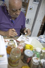 Tile painter in Salvador, Bahia State, Brazil, South America