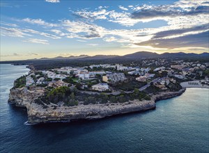 Sunset over Cala Anguila-Cala Mendia from a drone, Porto Cristo, Majorca, Spain, Europe