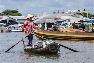 CAN THO, VIETNAM, 4 JUNE, 2011: Unidentified woman at floating market in Mekong river delta. Cai