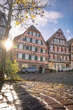 Half-timbered house in autumn with sun, Calw, Black Forest Germany