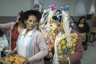 Wedding guests dancing with presents, Huancayo, Peru, South America