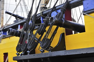 Wooden blocks and cannons on board of the Grand Turk, Etoile du Roy, a three-masted sixth-rate