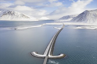 Aerial view over Sword bridge in winter, road bridge over Kolgrafafjörður in the north of the