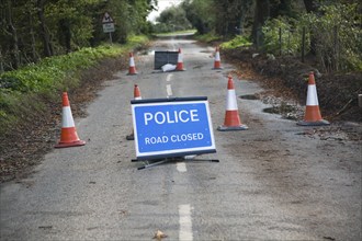 Police Road Closed sign with bollards UK Bawdsey, Suffolk, England, United Kingdom, Europe