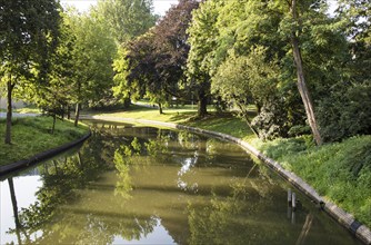 Tree lined waterway in park in central, Utrecht, Netherlands