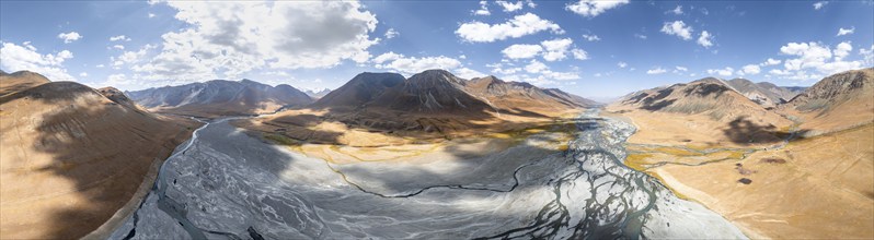 Aerial view, Burkhan mountain valley with meandering river, barren dramatic mountain landscape,