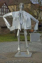 Sculpture Man with suitcase by Kurt Laurenz Metzler 2007, sculpture mile, male figure, sheet metal,