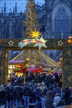 Christmas market at Roncalli Platz am Dom, in the city centre of Cologne, Sunday shopping in