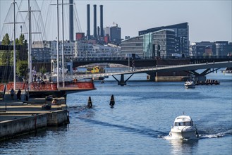 Cyclists on the Cirkelbroen cycle and footpath bridge, over the harbour, in the Christianshavens