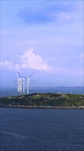 Renewable energy wind power plant and wind turbines along Denmark sea shoreline near Copenhagen