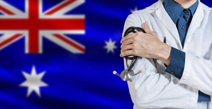 Doctor with stethoscope on Australia flag. Male Doctor holding stethoscope on Australian flag