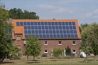 Residential building with photovoltaic system on the pitched roof, North Rhine-Westphalia, Germany,