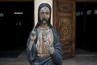 Wooden statue representing Jesus Christ at the entrance of the Saint François-Xavier church at