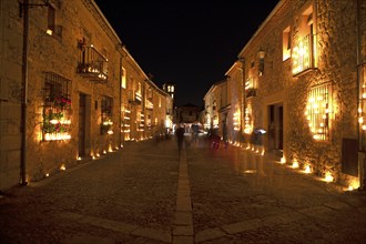 Calle Mayor at night, lit up with candles, Conciertos de las Velas festival of lights, Pedraza,