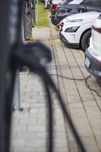 Electric cars at charging stations, Dresden, Saxony, Germany, Europe