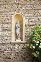 Statue detail in Italianate garden of landscape gardener Harold Ainsworth Peto created between 1899