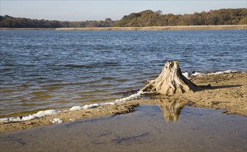 Benacre Broad lake is separated from the sea by the shingle beach bar of Benacre Ness, Suffolk,