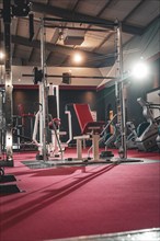 Empty training studio with a red weight bench on a red mat, Historic Fitness Studio, Bulls Fit,