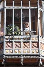 Window with doll in relation to textile industry, tradition, crafts, city trip, Bruges, Belgium,