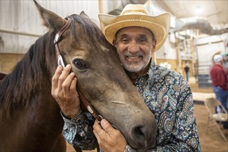 Oklahoma City, Oklahoma, A competitor with his horse at the Great Plains Rodeo, an annual gay rodeo