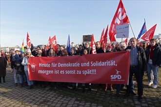 Protesters of the SPD with banner, today for democracy and solidarity, otherwise it will be too