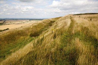 Ditch and earthwork ramparts of prehistoric hill fort of Liddington Castle, Wiltshire, England, UK