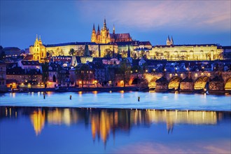 Travel Prague Europe concept background, view of Charles Bridge and Prague Castle in twilight.