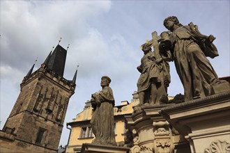 The Saints on Charles Bridge and the Lesser Town Bridge Tower, Prague, Czech Republic, Europe