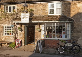 Traditional old fashioned exterior of village bakery shop at Lacock, Wiltshire, England, UK