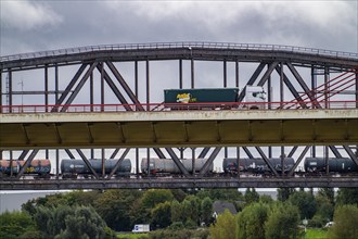 The Beeckerwerth Rhine bridge of the A42 motorway, truck traffic, behind it the Haus-Knipp railway