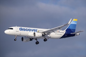 Discover Airbus A320-200, on approach to Frankfurt FRA Airport, Fraport, in winter, Hesse, Germany,