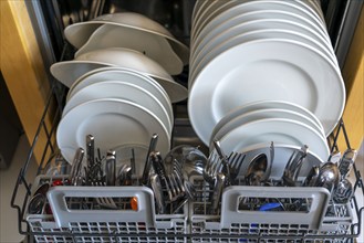 Dishwasher, full of clean crockery